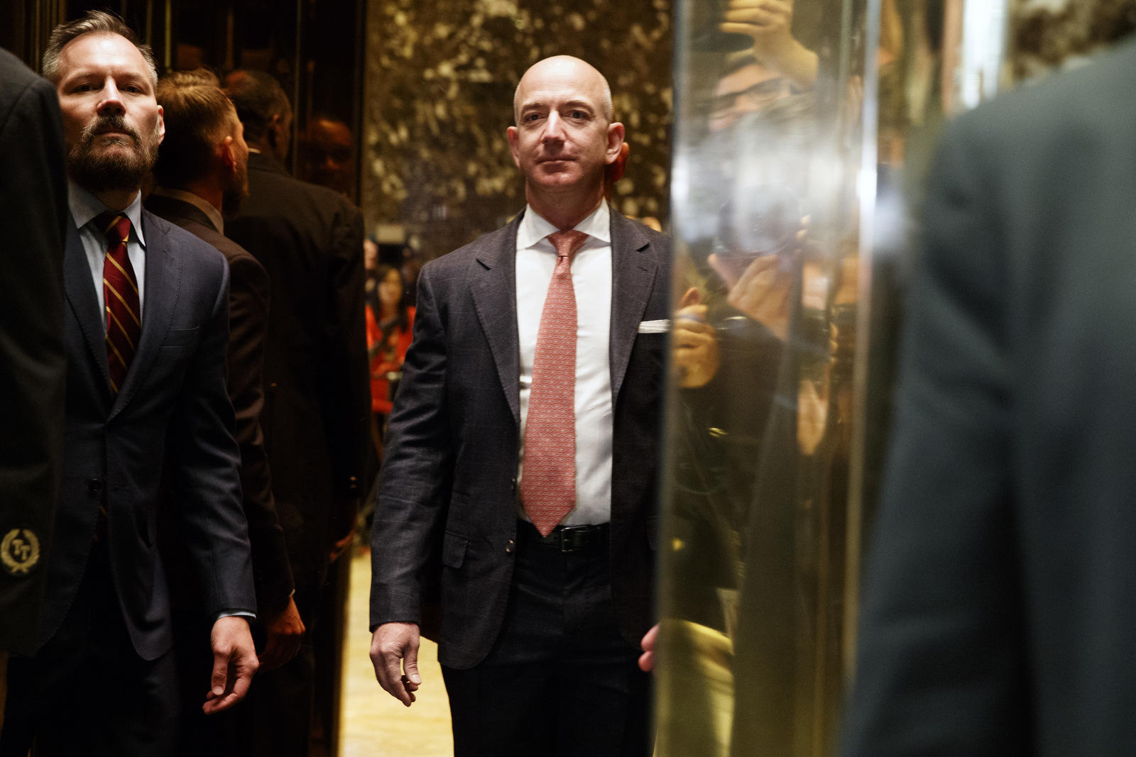 Amazon CEO and Wahsington Post owner, Jeff Bezos on an elevator for a meeting with then President-elect Donald Trump at Trump Tower in New York, Dec. 14, 2016. (AP/Evan Vucci)
