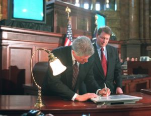 Photo: Vice President Al Gore looks on as President Clinton uses an electronic pen to sign the Telecommunications Reform Act, Thursday Feb. 8, 1996 at the Library of Congress in Washington. With high-tech fanfare and a touch of humor, the president signed the bill to revolutionize the way Americans get telephone and computer services. (AP Photo/Doug Mills)