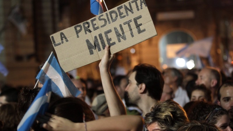 File: A protester holds up a sign that reads in Spanish "the president lies" during a march against Argentina's President Cristina Fernandez in Buenos Aires, Argentina, Thursday, Nov. 8, 2012. (AP Photo/Victor R. Caivano)
