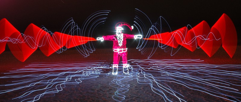 A Santa shaped figure made from a long-exposure photograph of lights. 