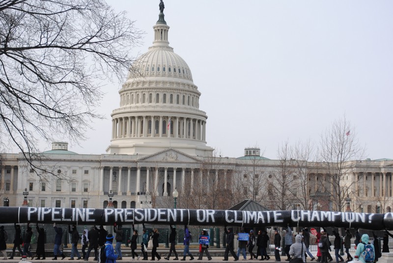 File: 350.org and their allies paraded a giant 200 yard inflatable pipeline around the Capitol Building. (350.org / Flickr)