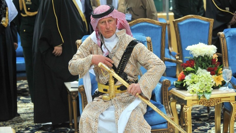 Britain's Prince Charles wears a traditional Saudi uniform as he attends the traditional Saudi dancing best known as performed during Janadriya culture festival at Der'iya in Riyadh, Tuesday, Feb. 18, 2014. Photo: Fayez Nureldine/AP