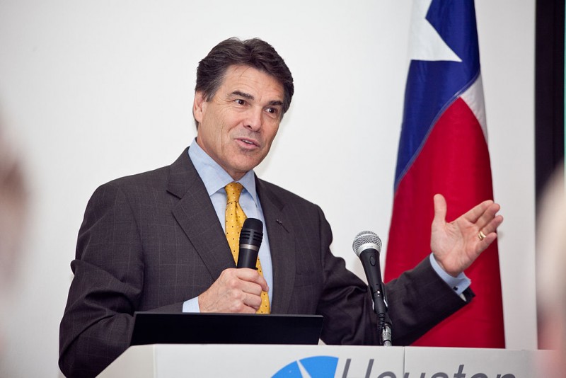 Former Texas Governor Rick Perry speaks at a podium in Houston, Texas on September 29, 2010. Despite pending felony charges, Perry has gone from his leadership of the state of Texas to the board of directors for Energy Transfer Partners, who hope to build an oil pipeline across Iowa. (Wikimedia / Ed Shipul)