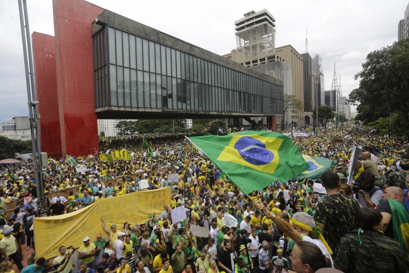Demonstrators march to demand the impeachment of Brazil's President Dilma Rousseff in Sao Paulo, Brazil, Sunday, March 15, 2015. Brazilians are demonstrating amid an inquiry into a kickback scheme at state-run oil company Petrobras, which prosecutors call the biggest corruption case yet uncovered in Brazil. (AP Photo/Nelson Antoine)