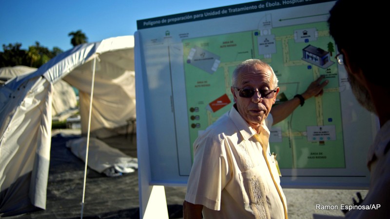 Jorge Perez, the head of Cuba's top tropical medicine institute, points to a map, showing the location of the field hospital set up to train doctors in the fight against Ebola, in Havana, Cuba, Friday, Oct. 17, 2014. Unlike the troops sent by the United States, Cuba's medical professionals arrived with intensive training in fighting the disease and can measure their success in over 200 lives saved.