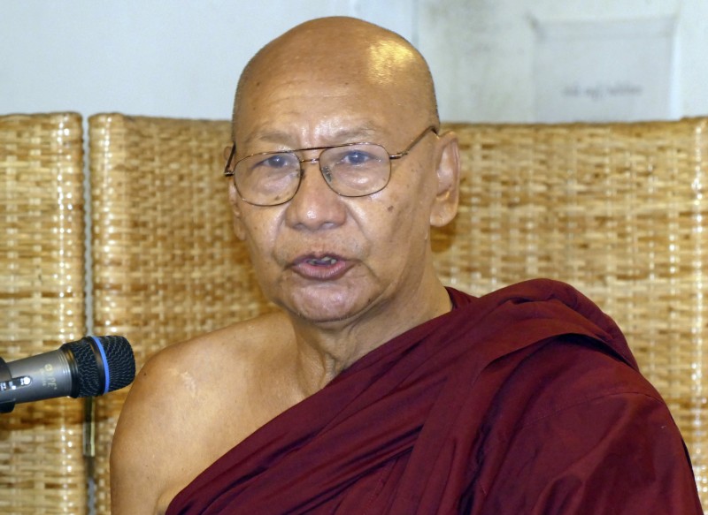 Monk U Tikha Nyana speaks during a press conference Monday, March 16, 2015, in Yangon, Myanmar. Two Buddhist monks who were among scores seriously burned during a 2012 police crackdown on protesters campaigning against a Chinese-backed copper mine said Monday that they are suing Myanmar's home minister and police chief. U Tikha Nyana, 66, suffered burns over about 60 percent of his body during the crackdown. (AP Photo/Khin Maung Win)