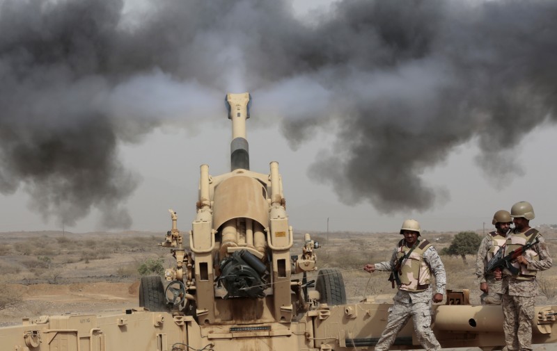 Saudi soldiers fire artillery toward three armed vehicles approaching the Saudi border with Yemen in Jazan, Saudi Arabia, Monday, April 20, 2015. The Saudi air campaign in Yemen, now in its fourth week, has strong support from the government of the United Kingdom. (AP Photo/Hasan Jamali)