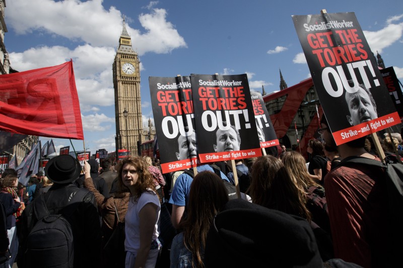 Protesters demonstrate against the Conservative government in Westminster, London, Saturday, May 9, 2015. David Cameron's Conservative Party swept to power Friday in Britain's Parliamentary General Elections, winning an unexpected majority. (AP Photo/Tim Ireland)