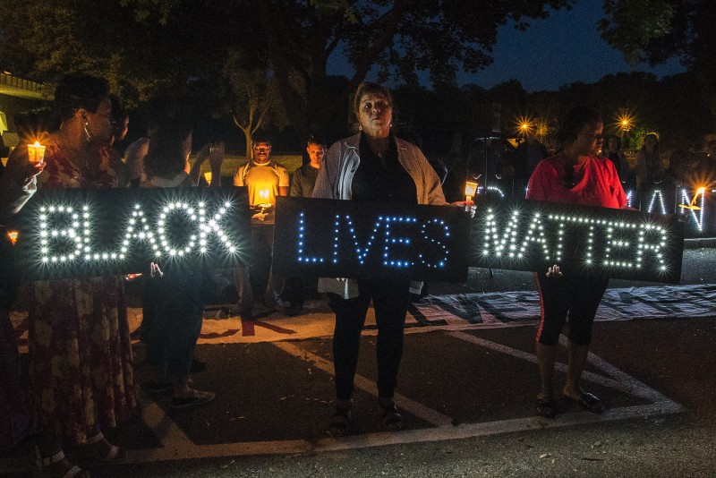 Lighted signs spell out "BLACK LIVES MATTER" at a rally for the Charleston Shooting held on June 19, 2015 in Madison, Wisconsin. Though some conservatives want to dismiss the movement, Black Lives Matter highlights genuine issues of systemic racism and inequality. (Flickr / Light Brigading)