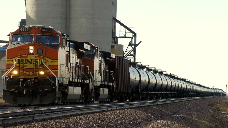 In this Nov. 6, 2013, file photo, a BNSF Railway train hauls crude oil near Wolf Point, Mont. More dangerous "bomb trains" could soon be on U.S. tracks if Obama lifts a ban on crude oil exports. (AP Photo/Matthew Brown, File)