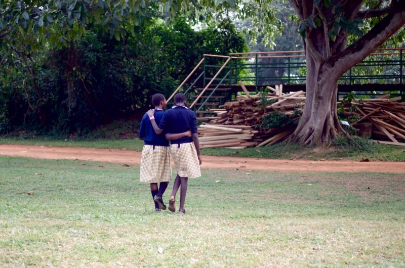 Two Sudanese refugees from the Come True Project embrace after a long day exploring Uganda's Entebbe Wildlife Sanctuary. (Rami Gudovitch)