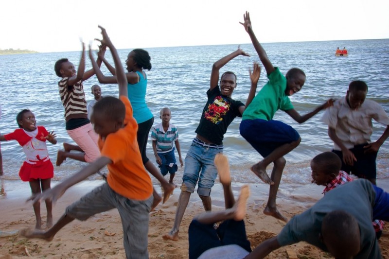 Young refugees of South Sudan play at Victoria Lake in Uganda. Uganda's Come True Project, and its director Rami Gudovitch, work to protect these refugee children that were previously deported by Israel. (Rami Gudovitch)