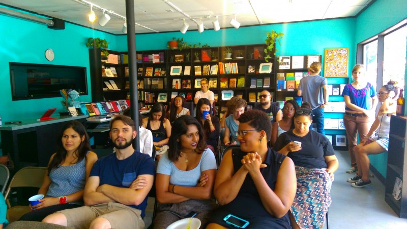 Audience and participants await the start of "Imagining Revolutionary Media," a discussion held on July 18. 2015 at Monkeywrench Books in Austin, Texas. (MintPress News / Kit O'Connell)