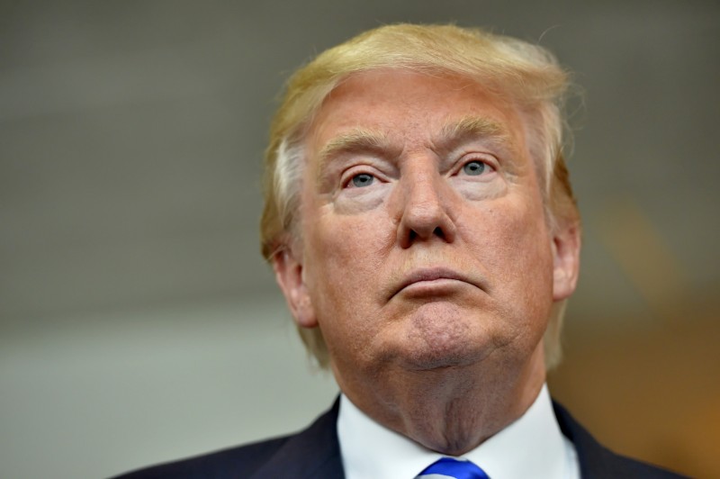 In this Thursday, Aug. 27, 2015, photo, Republican presidential candidate Donald Trump listens during a news conference after speaking at the TD Convention Center, in Greenville, S.C. (AP Photo/Richard Shiro)