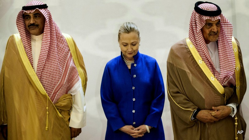 Saudi Foreign Minister Prince Saud Al-Faisal, right, U.S. Secretary of State Hillary Clinton, center, and Kuwaiti Foreign Minister Sheikh Sabah Khaled al-Hamad Al-Sabah, left, stand together prior to a group photo before a US- Gulf Cooperation Council forum at the Gulf Cooperation Council Secretariat in Riyadh, Saudi Arabia, Saturday, March 31, 2012. (AP Photo/Brendan Smialowski, Pool)