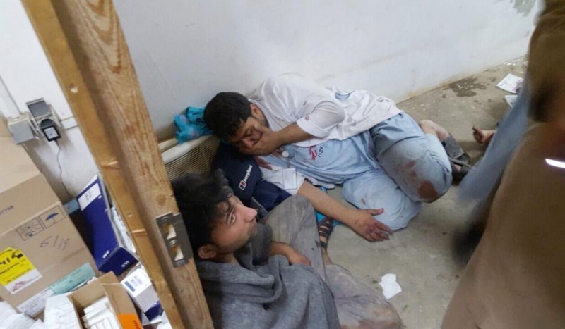 In this Saturday, Oct. 3, 2015 file photo, injured Doctors Without Borders staff are seen near their hospital after it was hit by a U.S. airstrike. The attack, which killed a number of hospital staff and patients, was intended to back up Afghan forces fighting to dislodge Taliban insurgents who overran the strategic city earlier in the week. (Médecins Sans Frontières via AP, File)