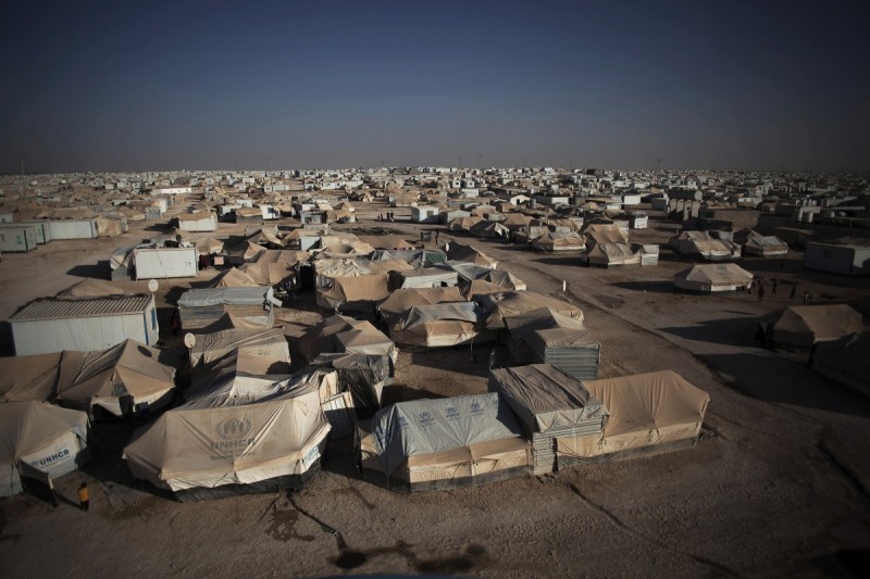 This Wednesday, Oct. 23, 2013 file photo, shows a general view of Zaatari refugee camp near the Syrian border in Jordan. The United Nations says it is alarmed at "violent nature" of a demonstration in a massive Syrian refugee camp in Jordan that killed one person and wounded dozens. The U.N. refugee agency says a "heated demonstration" in Jordan's sprawling Zaatari refugee camp Saturday turned to "a violent one" after hundreds, possibly thousands of refugees started throwing rocks at a police post. (AP Photo/Manu Brabo, File)