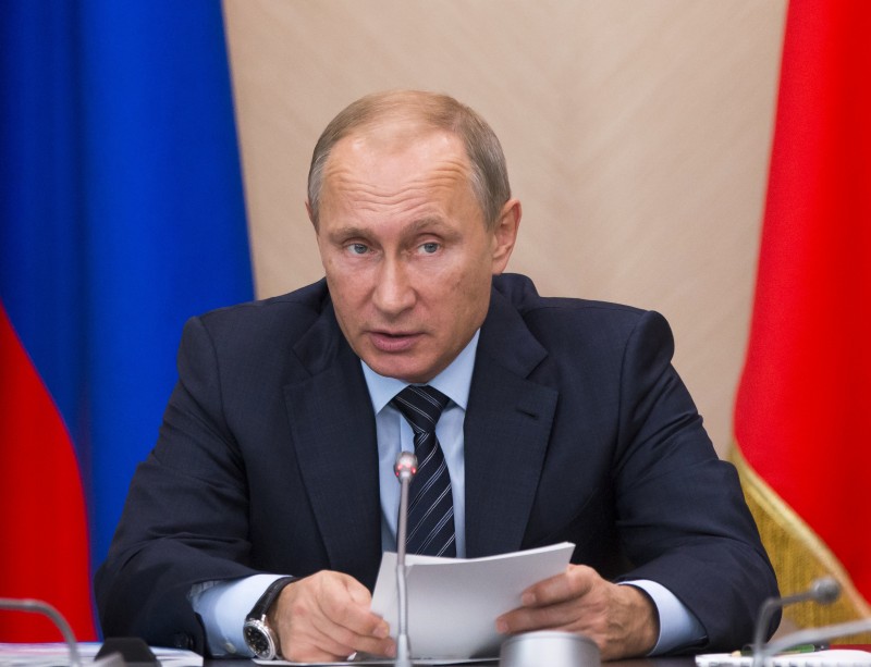 In this Monday, Oct. 19, 2015, file photo, Russian President Vladimir Putin speaks during a State Council meeting at the Novo-Ogaryovo residence outside Moscow. Syrian state media says President Bashar Assad has met with Putin in Moscow, in the first known trip abroad for the embattled leader since war broke out in his country in 2011. (AP Photo/Alexander Zemlianichenko, pool, File)