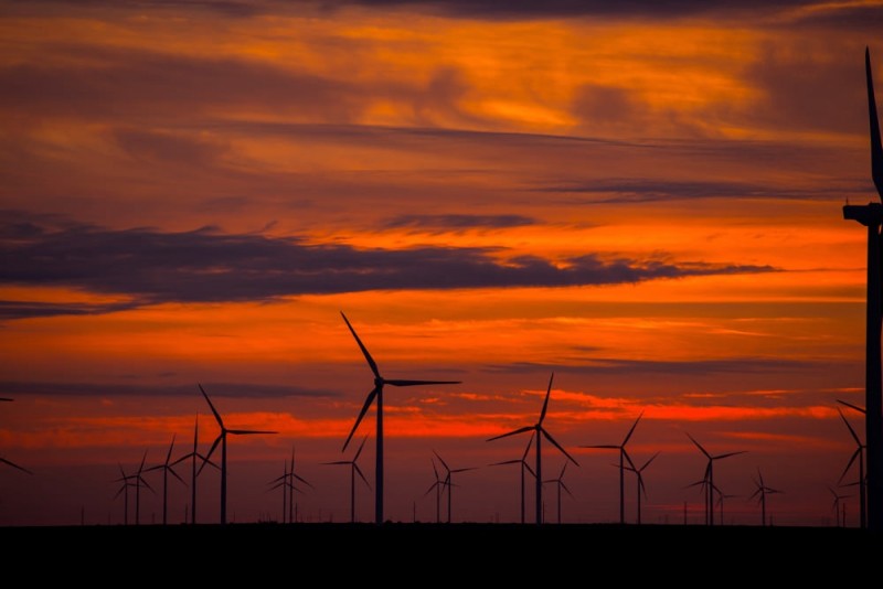 In this December 12, 2014 photo, the turbines of a wind farm near Harlingen, Texas are seen silhouetted against the sky at sunset. (Flickr / Duke Energy)