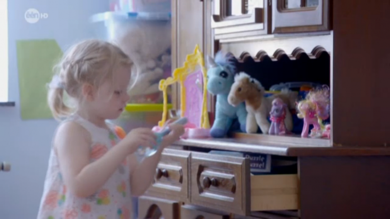 Sofie Voncken, a young girl from Belgium who suffers from extremely severe epilepsy, plays with her toys during an appearance on the Flemish TV show "Koppen." Sofie's condition may be alleviated by CBD oil, a medical derivative of cannabis, but Belgian law does not legally allow its use yet for her condition. (Screenshot from "Koppen")