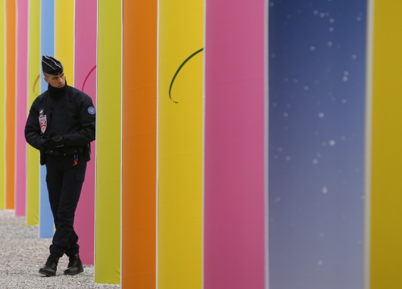 A riot police officer patrols at the COP21, the United Nations Climate Change Conference Tuesday, Dec. 1, 2015 in Le Bourget, north of Paris. (AP Photo/Christophe Ena)