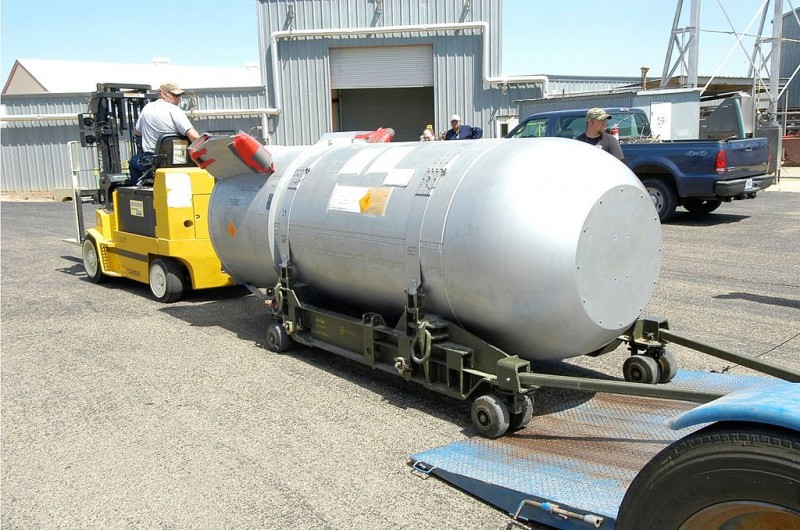 In this February 14, 2011 photograph, a worker using a yellow tractor moves a B53 nuclear warhead to prepare for its disassembly at the Pantex Plant in Amarillo, Texas. (Wikimedia Commons / National Nuclear Security Administration)
