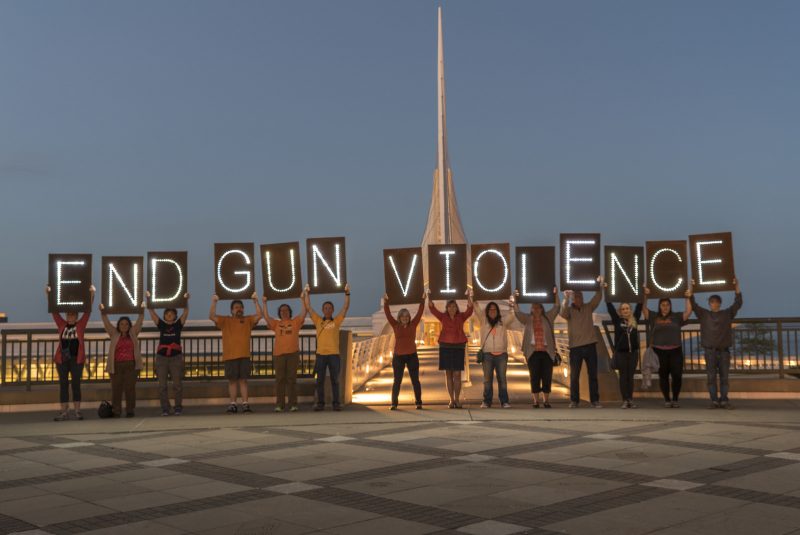Members of the Milwaukee-based Overpass Light Brigade hold lighted signs reading "End Gun Violence." January 1, 2014. (Flickr / Joe Brusky)