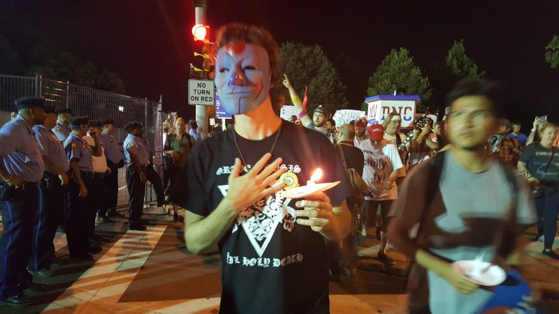 An activist in an "Anonymous" mask marches with a candle during a rally of Bernie Sanders supporters on July 27, 2016 in Philadelphia, near the Democratic National Convention. (Kit O'Connell)