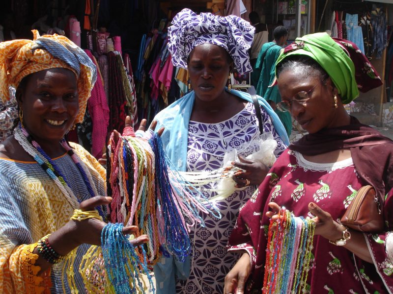 File: Women in Senegal shop for beaded jewelry. May 6, 2007. (Flickr / BobbiLe Ndiaye)
