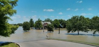 A flooded Texas road. Texas infrastructure was rated “D” for roads and flood protection in 2012. (Flickr / Steve Rainwater, CC SA)