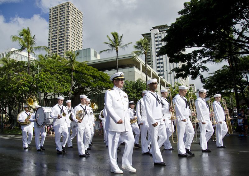 The U.S. Pacific Fleet Marching Band participates in a parade through downtown Waikiki honoring Japanese-American veterans of World War II . December 18, 2011. (Wikimedia Commons / U.S. Navy / Mass Communication Specialist 2nd Class Daniel Barker)