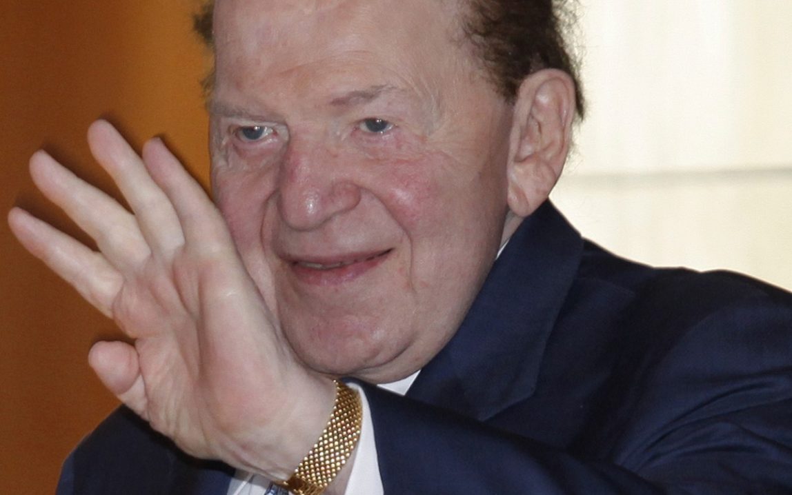 This June 7, 2011, file photo shows Las Vegas Sands Chairman and CEO Sheldon Adelson waving to reporters as he arrived for Sands China's annual meeting in Hong Kong. (AP Photo/Vincent Yu, File)