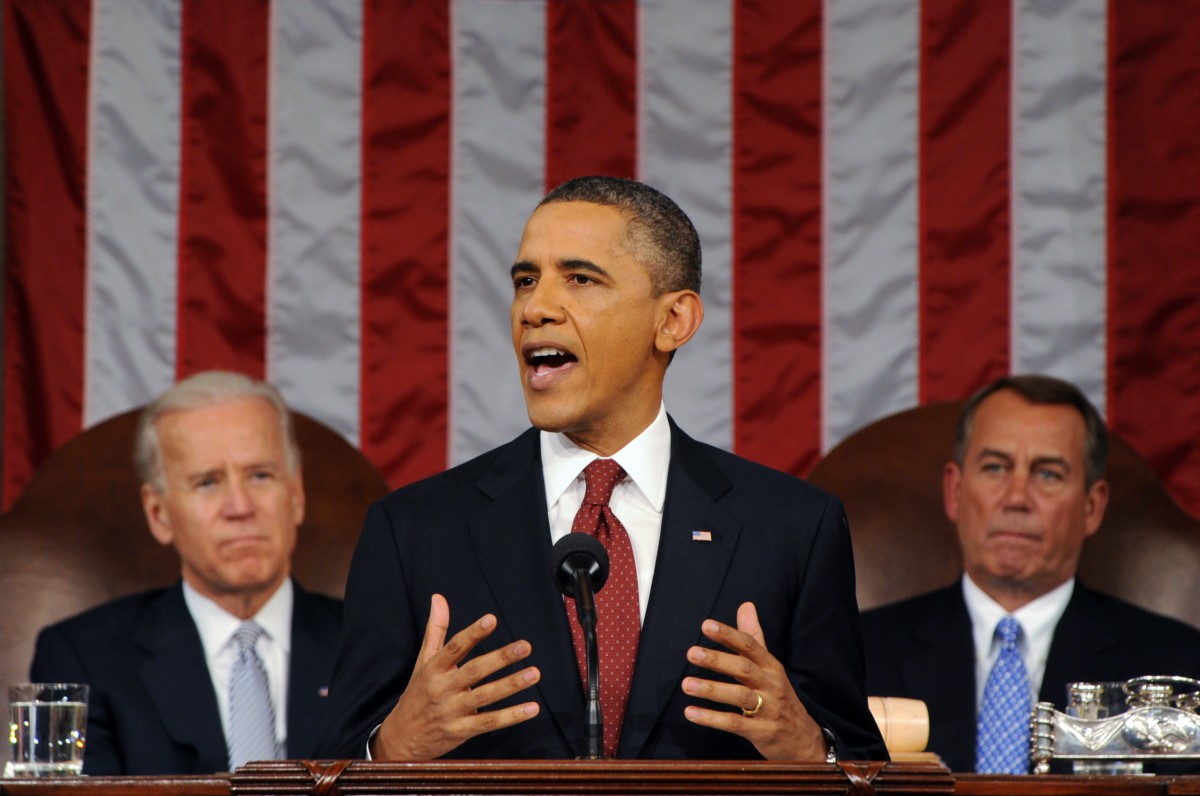 President Barack Obama delivers his State of the Union address on Capitol Hill in Washington, Tuesday, Jan. 24, 2012. Listening in back are Vice President Joe Biden and House Speaker John Boehner, right. (AP Photo/Saul Loeb, Pool)