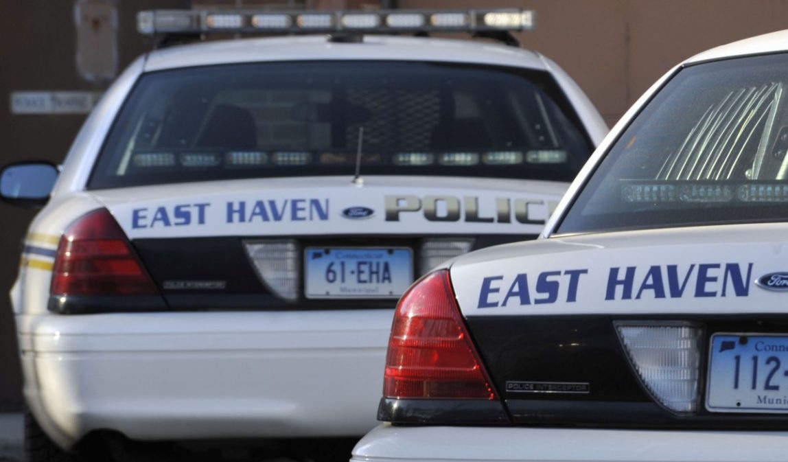 In this Wednesday, Dec. 22, 2010 file photo, East Haven police vehicles are seen outside the police department in East Haven, Conn. (AP Photo/Jessica Hill, File)