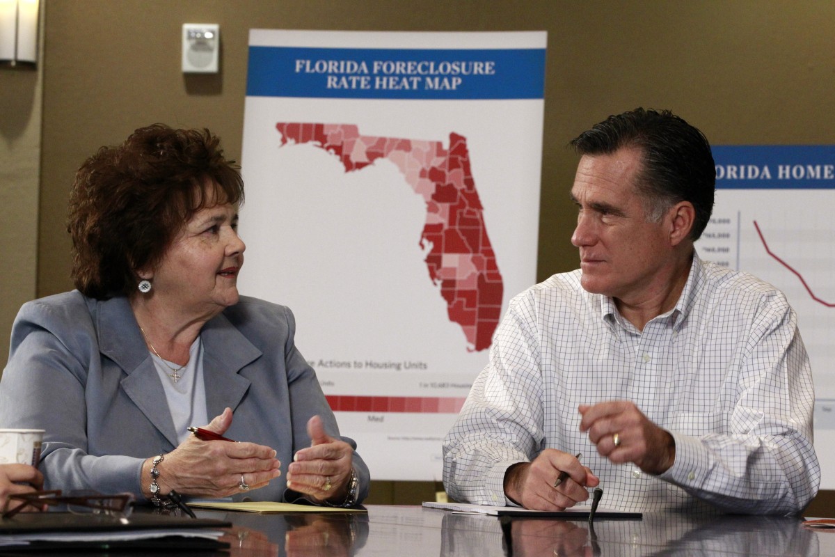 Republican presidential candidate, former Massachusetts Gov. Mitt Romney, sits with Mary Pinion of Tampa, Fla., as he holds a discussion on housing and foreclosure, Monday, Jan. 23, 2012, in Tampa, Fla. (AP Photo/Charles Dharapak)