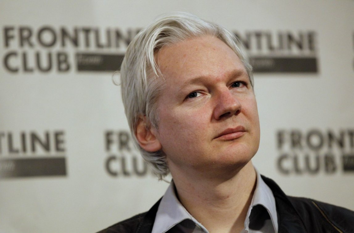 Julian Assange, founder of WikiLeaks listens at a press conference in London, Monday, Feb. 27, 2012. (AP Photo/Kirsty Wigglesworth)