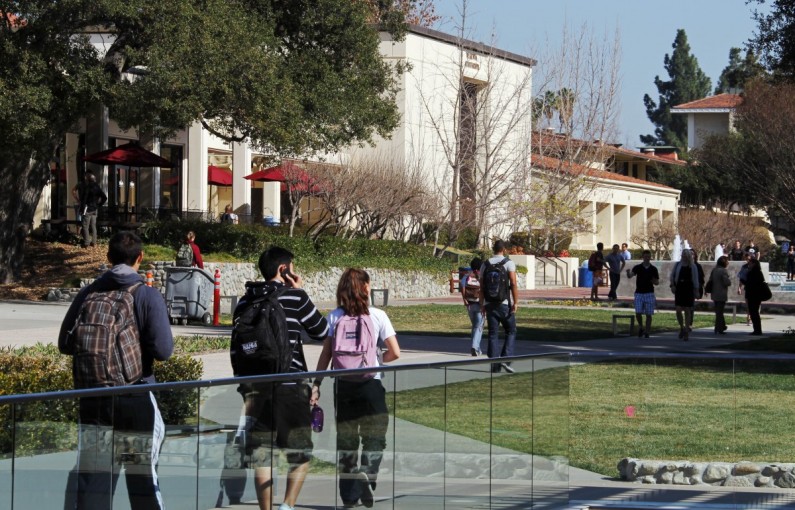 In this Thursday, Feb. 2, 2012 photo, students walk through the campus of Claremont McKenna College in Claremont, Calif. (AP Photo/Reed Saxon)
