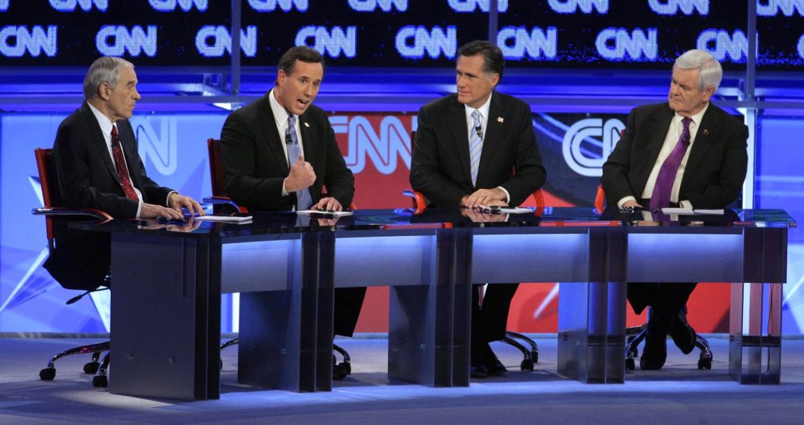 Republican presidential candidates, from left, Rep. Ron Paul, R-Texas, former Pennsylvania Sen. Rick Santorum, former Massachusetts Gov. Mitt Romney and former House Speaker Newt Gingrich share the stage during a Republican presidential debate Wednesday, Feb. 22, 2012, in Mesa, Ariz. (AP Photo/Jae C. Hong)