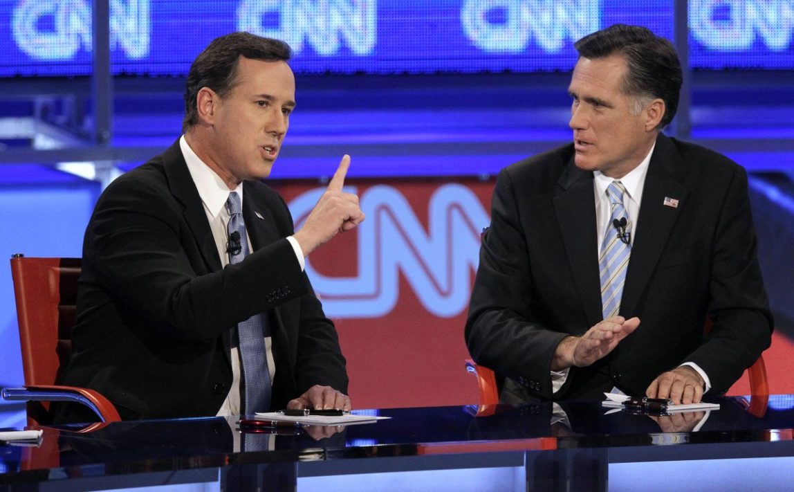 Republican presidential candidate, former Pennsylvania Sen. Rick Santorum, left, makes a point as former Massachusetts Gov. Mitt Romney listens during a Republican presidential debate Wednesday, Feb. 22, 2012, in Mesa, Ariz. (AP Photo/Jae C. Hong)