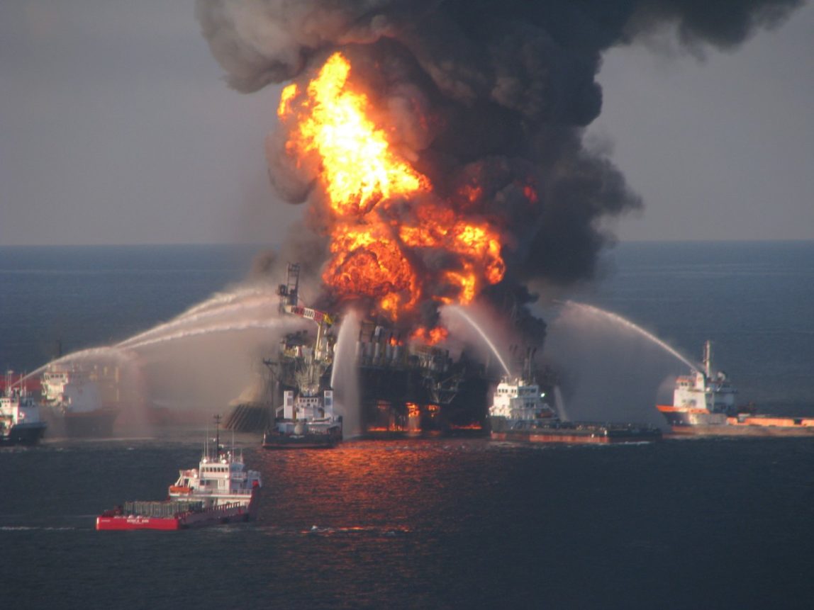 In this April 21, 2010 photo provided by the U.S. Coast Guard, fire boat response crews spray water on the burning remnants of BP's Deepwater Horizon offshore oil rig. (AP Photo/US Coast Guard, File)