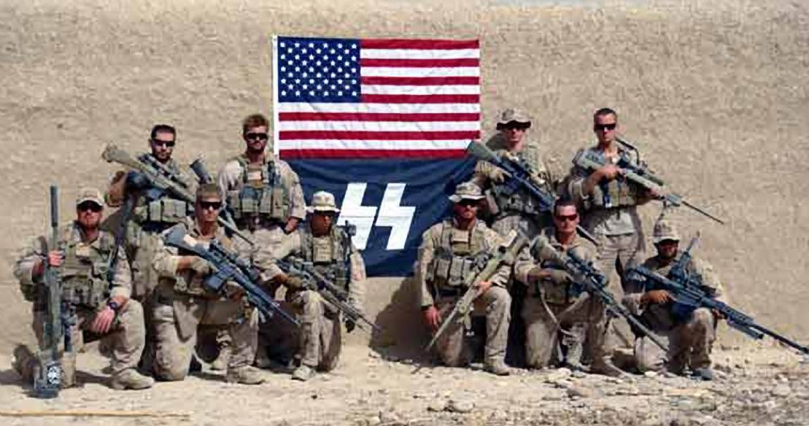 Marines posed with logo resembling Nazi symbol