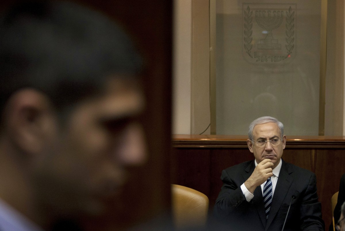 Israeli Prime Minister Benjamin Netanyahu attends the weekly Cabinet meeting in his office in Jerusalem, Sunday, Feb. 19, 2012. (AP Photo/Sebastian Scheiner, Pool)