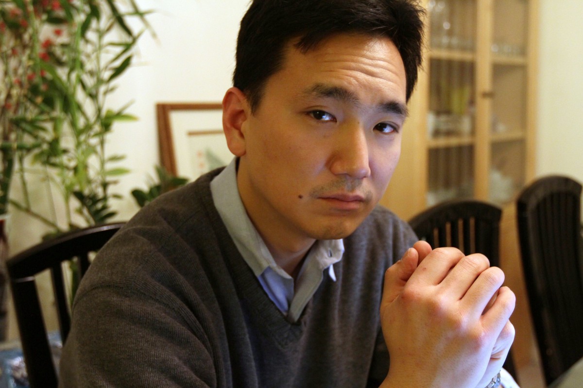 In this Jan. 20, 2012 photo, Daniel Kim poses for a photograph at his home in the Queens borough of New York. Kim is a former U.S. Army Staff Sergeant. Kim is a 39-year-old Korean-American who spent 12 years in the infantry before leaving the service in 2004. (AP Photo/Tina Fineberg)