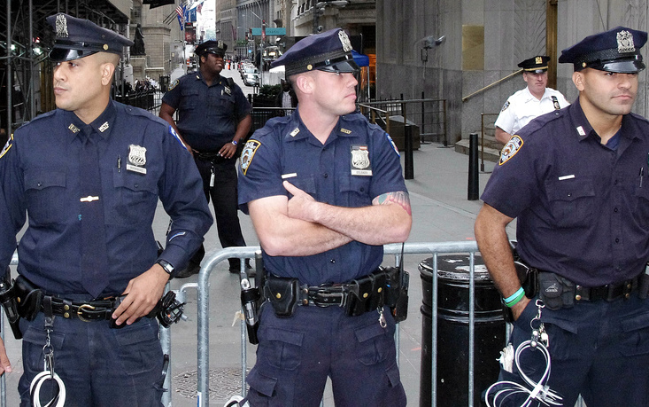 Officers from the NYPD stand on a street in New York City. (Photo by David Shankbone)