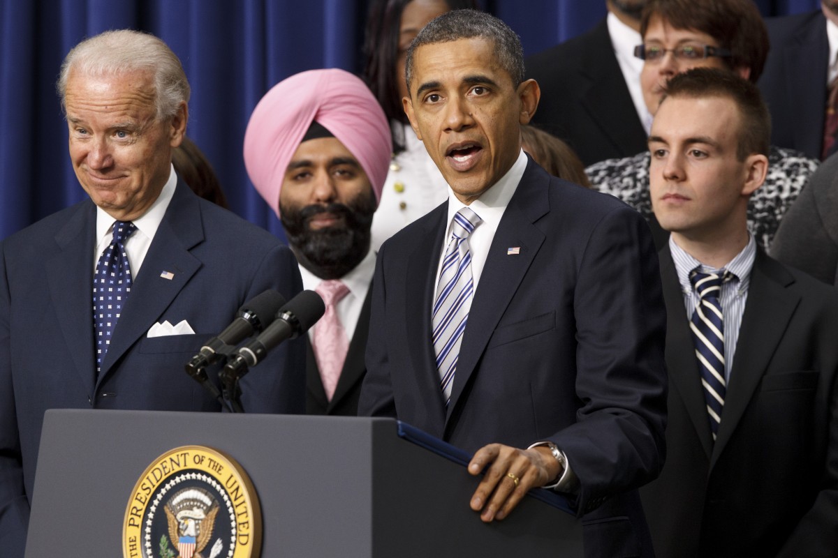 President Barack Obama, accompanied by Vice President Joe Biden, talks about the importance of the payroll-tax cut and jobless-benefits extension compromise that bi-partisan House and Senate conferees reached last week, Tuesday, Feb. 21, 2012, in the Eisenhower Executive Office Building on the White House complex in Washington. (AP Photo/J. Scott Applewhite)