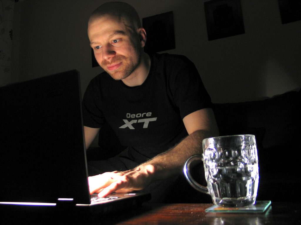 A man uses the Internet at his home. (Photo by Phil Gradwell)