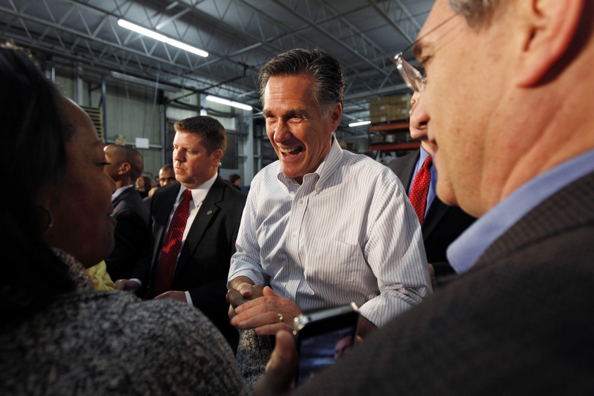 Republican presidential candidate, former Massachusetts Gov. Mitt Romney greets supporters at a campaign rally in Kentwood, Mich., Wednesday, Feb. 15, 2012. Romney is faltering with white working-class voters crucial to his partys drive to capture the White House. Thats a problem for him because hes trying to fend off a rising GOP challenger, Rick Santorum, who appeals strongly to that group. Combined polls of voters in the first five states that held presidential nominating contests show Romney has led his rivals by comfortable margins among white college graduates. (AP Photo/Gerald Herbert)