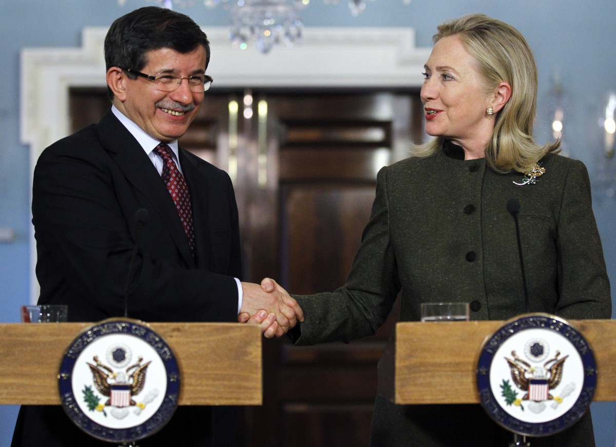Secretary of State Hillary Rodham Clinton and Turkish Foreign Minister Ahmet Davutoglu shake hands during a joint news conference, Monday, Feb. 13, 2012, at the Department of State in Washington. (AP Photo/Haraz N. Ghanbari)