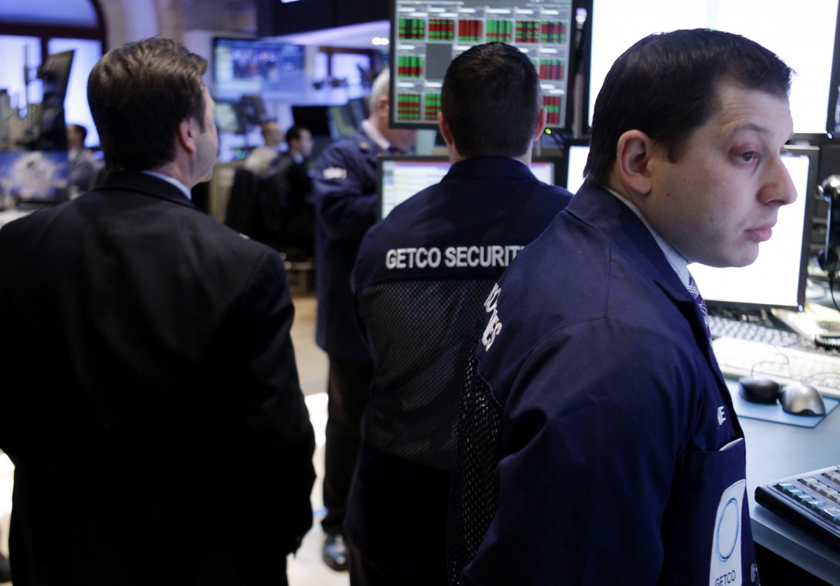 In this Feb. 21, 2012 photo, traders work on the floor at the New York Stock Exchange. Markets were subdued Thursday, Feb. 23, 2012, as Greece pressed ahead with reforms demanded by its creditors in exchange for crucial bailout cash and as tensions rose in the Persian Gulf over Iran's nuclear program. (AP Photo/Seth Wenig)