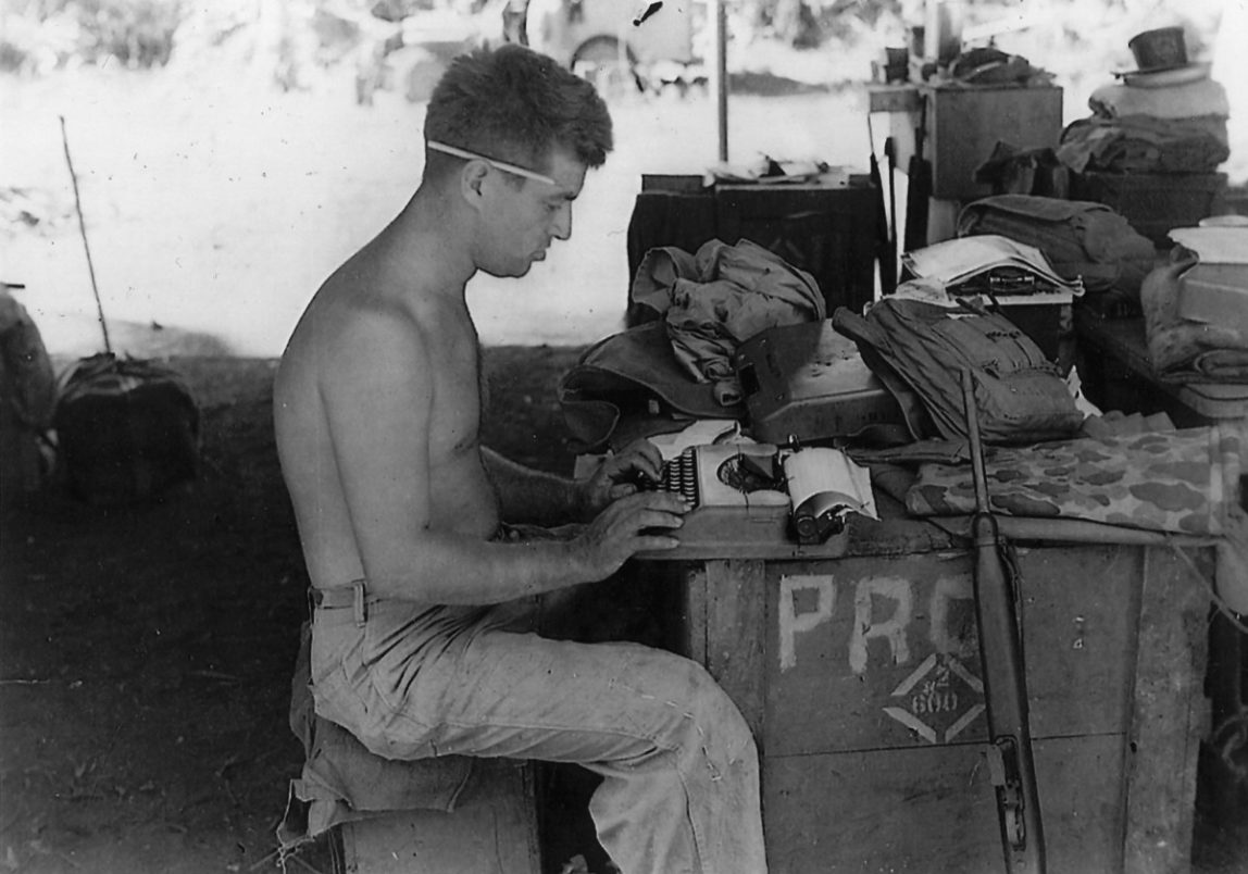In this 1944 photo, Cyril 'Cy' O'Brien, a former Marine combat correspondent, uses a typewriter on Guam. (Photo by Pacific War Museum)
